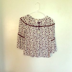 A long sleeve shirt that has flower designs